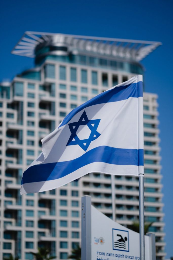 Israeli flag infornt of building